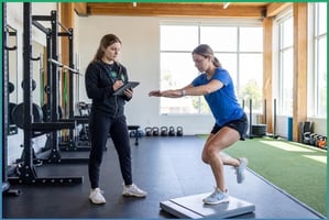 Patient performing functional movement assessment at a sports performance training facility in Shirley